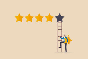 5 stars rating review high quality and good business reputation, customer feedback or credit score, evaluation rank concept, businessman holding 5th star climb up ladder to put on best rating.